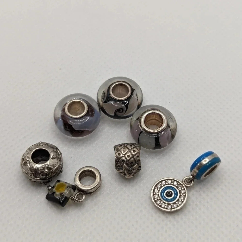 7 sterling  charms